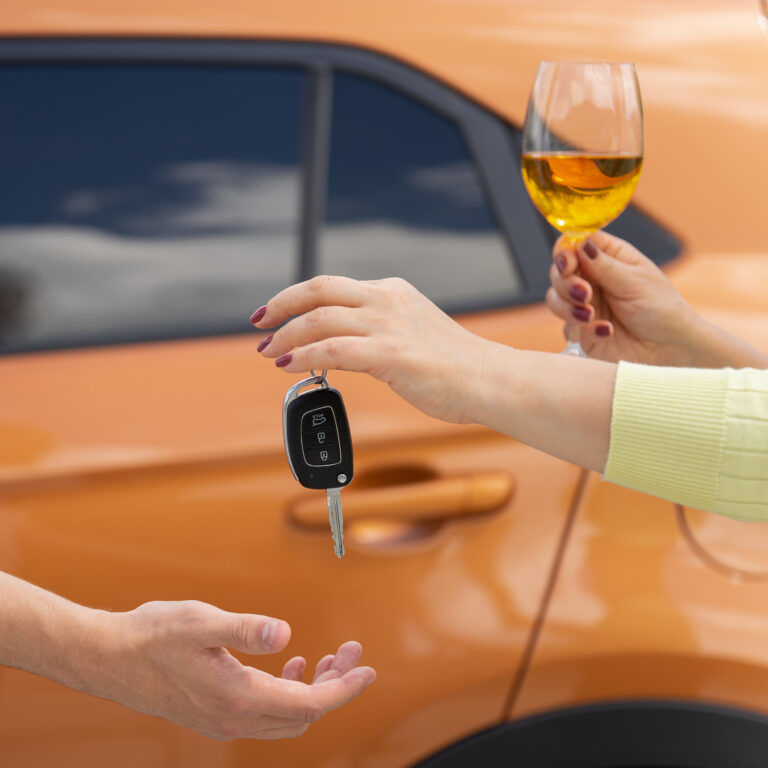 A,Woman,With,A,Glass,Of,Wine,Gives,The,Car